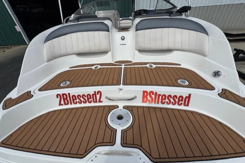 Slide: The Image of 2008 Yamaha Boats SX230 HO with custom deck design and humorous text decals. - 8