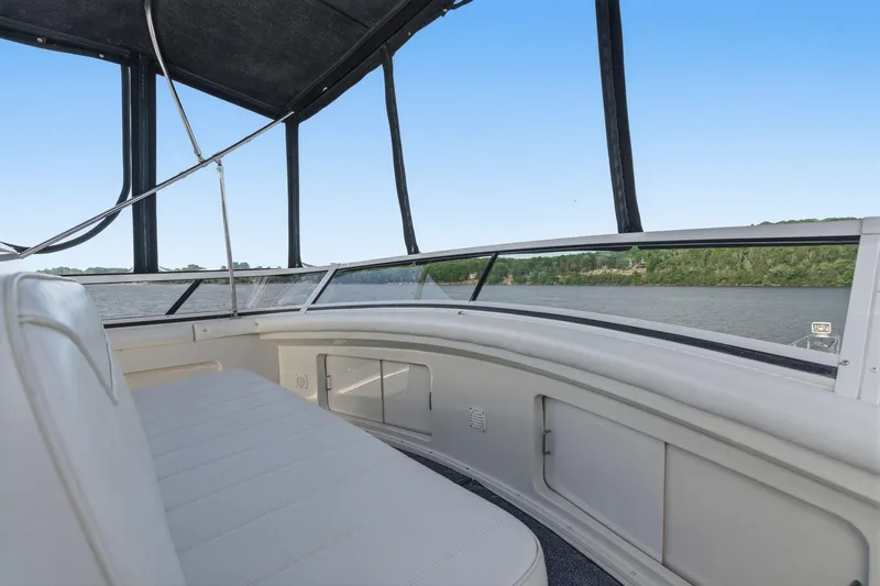 Slide: The Image of 1998 Carver 445 Aft Cabin Motor Yacht interior with scenic water view. - 13