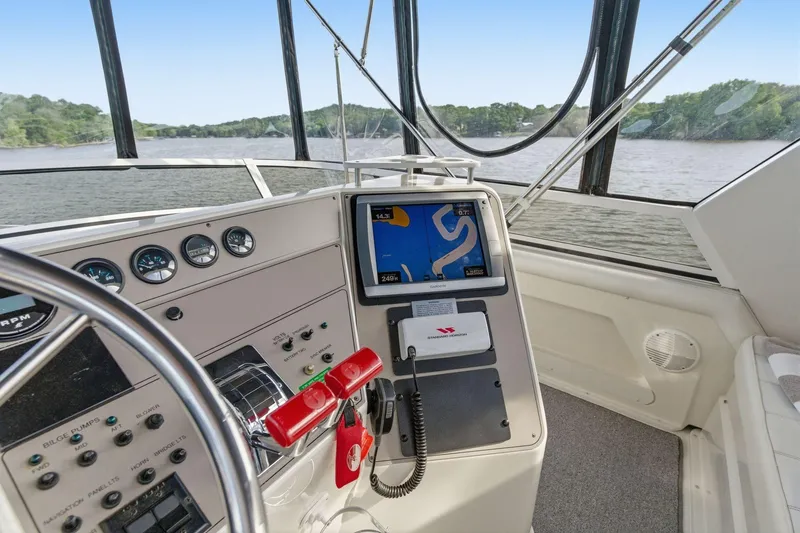 Slide: The Image of Cockpit view of 1998 Carver 445 Aft Cabin Motor Yacht with navigation equipment. - 16