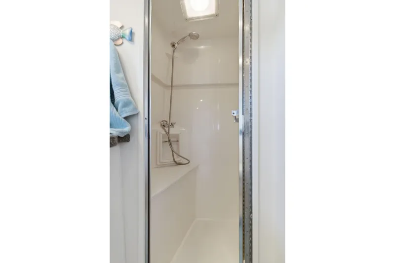 Slide: The Image of Shower area in 1998 Carver 445 Aft Cabin Motor Yacht, featuring sleek design and modern fixtures. - 38