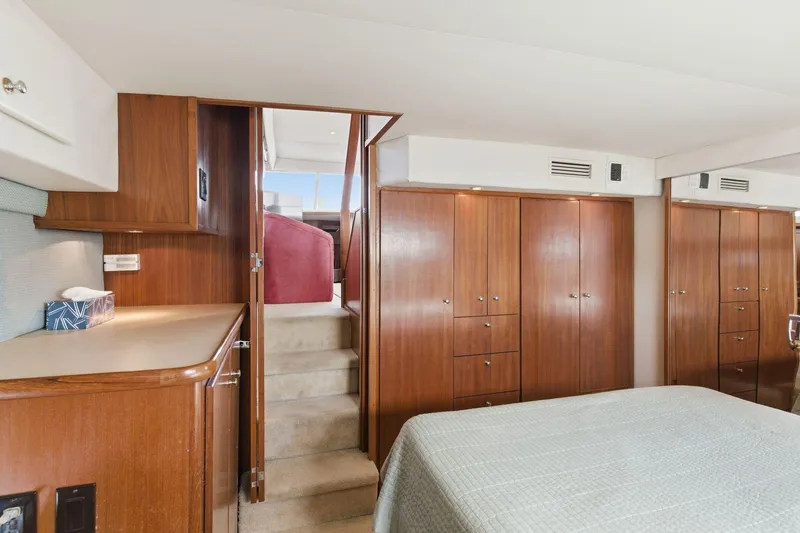 Slide: The Image of Interior of 1998 Carver 445 Aft Cabin Motor Yacht with wood cabinetry and stairs. - 39