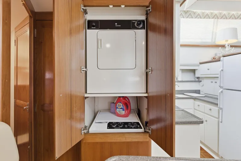 Slide: The Image of Laundry area in 1998 Carver 445 Aft Cabin Motor Yacht with washer and dryer. - 41