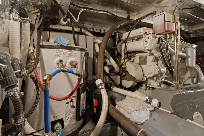 Slide: The Image of Engine room of 1998 Carver 445 Aft Cabin Motor Yacht, showcasing mechanical components. - 46