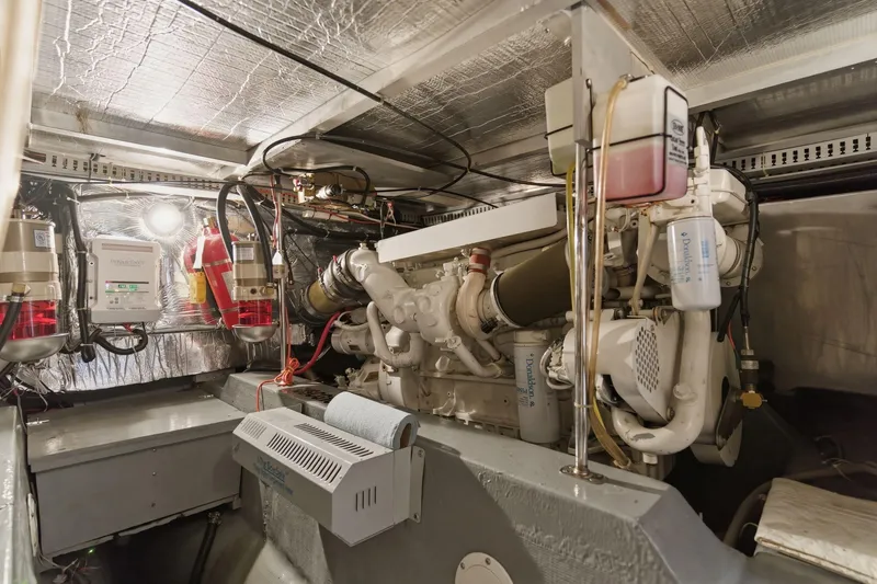 Slide: The Image of Engine room of 1998 Carver 445 Aft Cabin Motor Yacht, showcasing machinery and components. - 47