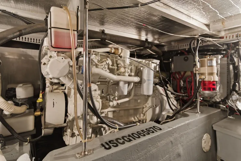 Slide: The Image of Engine room of 1998 Carver 445 Aft Cabin Motor Yacht, showcasing mechanical components. - 48