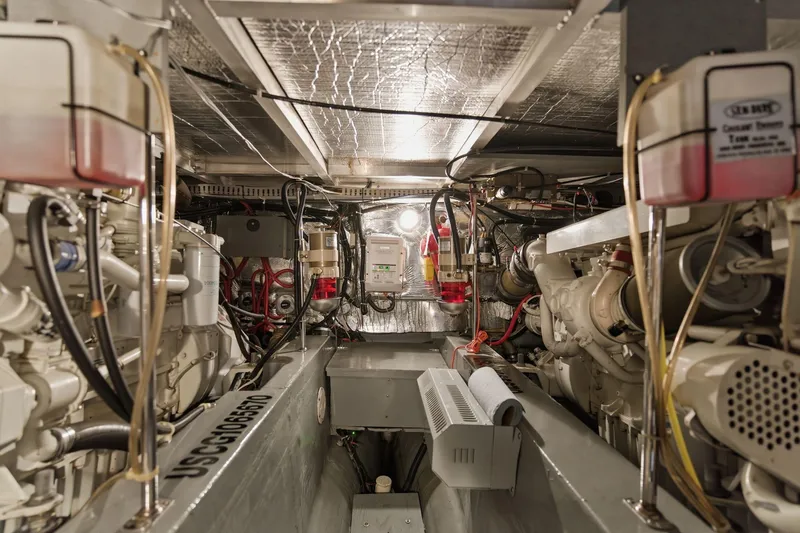 Slide: The Image of Engine room of 1998 Carver 445 Aft Cabin Motor Yacht, showcasing mechanical components and systems. - 50