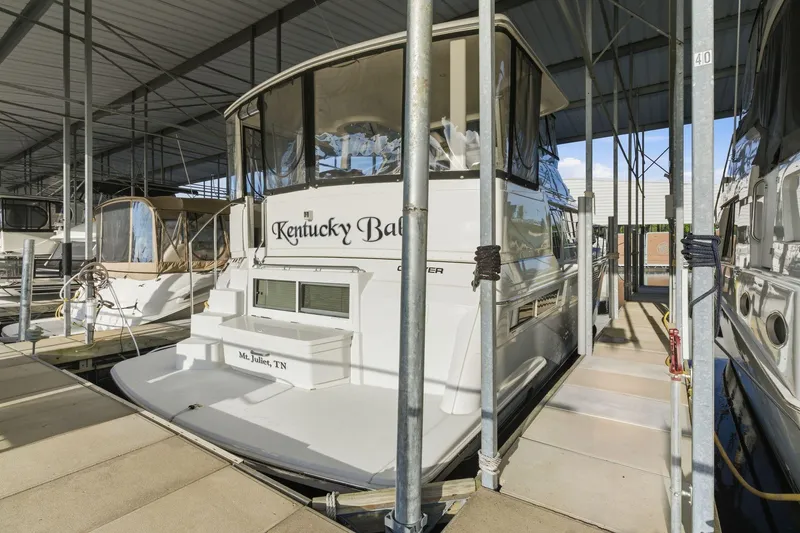 Slide: The Image of 1998 Carver 445 Aft Cabin Motor Yacht docked in marina. - 52