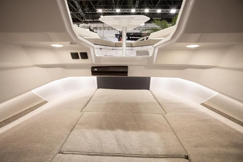 Slide: The Image of Interior cabin of 2026 Axopar 29 Sun-Top boat, featuring modern design and comfortable seating. - 5