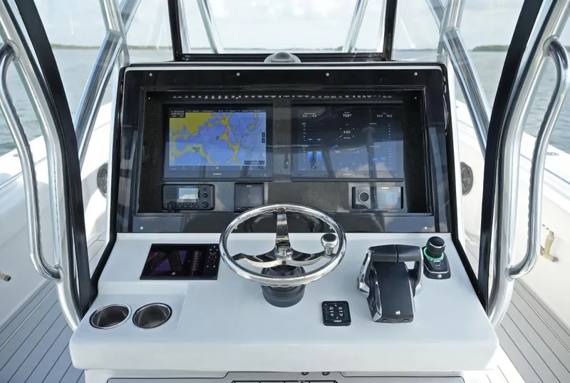 Slide: The Image of Manufacturer Provided Image: 2025 SeaHunter 38 CTS boat dashboard with advanced navigation and control systems. - 4