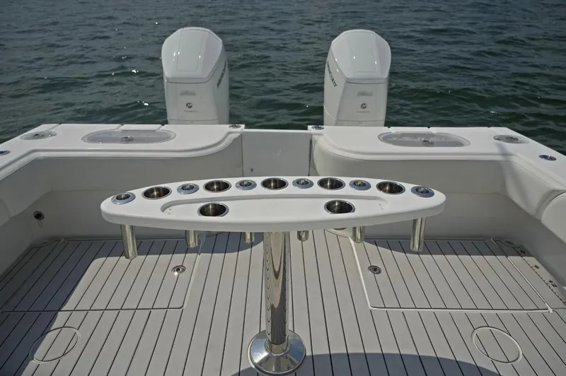 Slide: The Image of Manufacturer Provided Image: 2025 SeaHunter 38 CTS boat deck with dual engines and rod holders. - 6