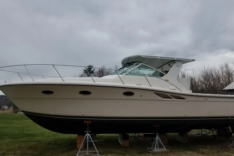 Slide: The Image of 1998 Tiara Yachts 3500 Open boat on stands, overcast sky background. - 12
