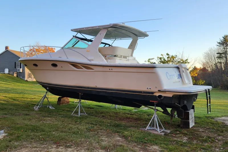Slide: The Image of 1998 Tiara Yachts 3500 Open on stands, displayed outdoors on grass. - 15