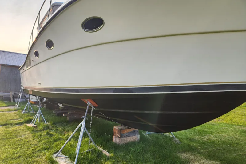 Slide: The Image of 1998 Tiara Yachts 3500 Open on stands, side view, outdoors. - 18