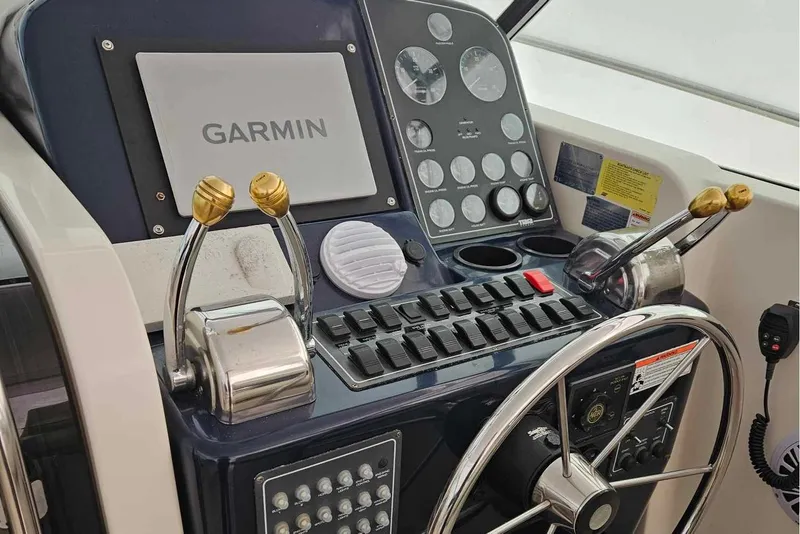 Slide: The Image of Control panel of a 1998 Tiara Yachts 3500 Open with Garmin navigation system. - 34
