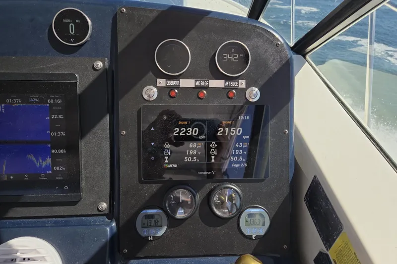 Slide: The Image of Control panel of a 1998 Tiara Yachts 3500 Open, displaying engine and navigation data. - 38