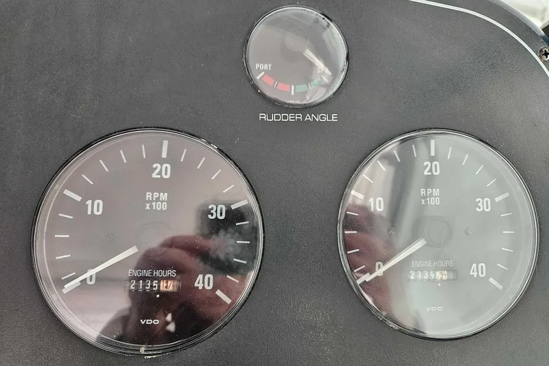 Slide: The Image of Dashboard of a 1998 Tiara Yachts 3500 Open showing RPM and rudder angle gauges. - 40