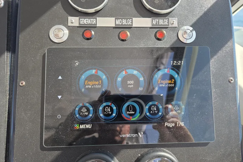 Slide: The Image of Dashboard of a 1998 Tiara Yachts 3500 Open, displaying engine and system gauges. - 43