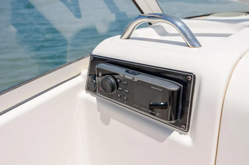 Slide: The Image of Fusion marine stereo on 2019 Grady-White Freedom 215 boat dashboard. - 13