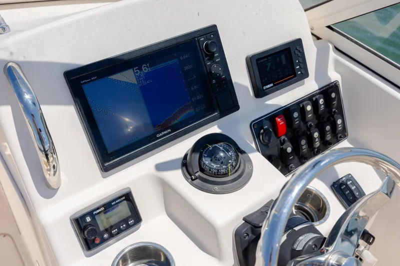 Slide: The Image of Control panel of 2019 Grady-White Freedom 215 boat with Garmin navigation system. - 19