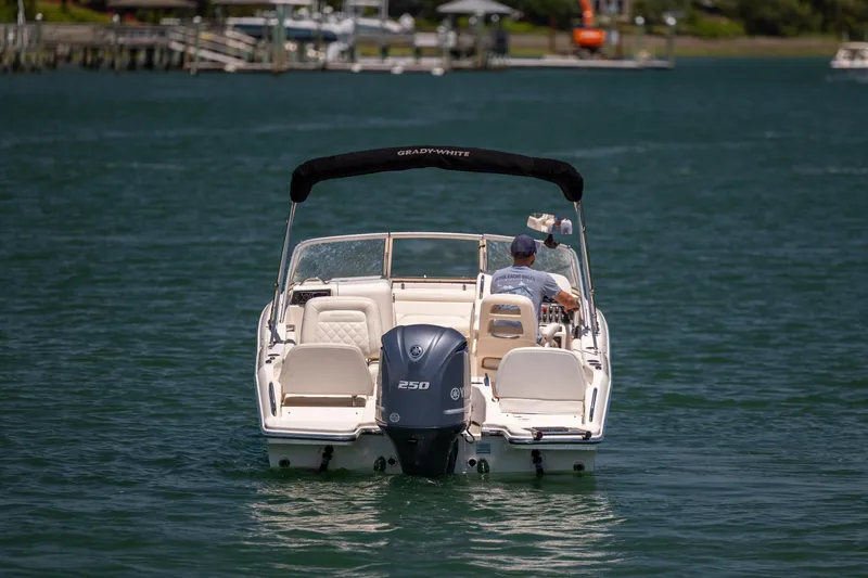 Slide: The Image of 2019 Grady-White Freedom 215 boat cruising on a sunny day. - 3