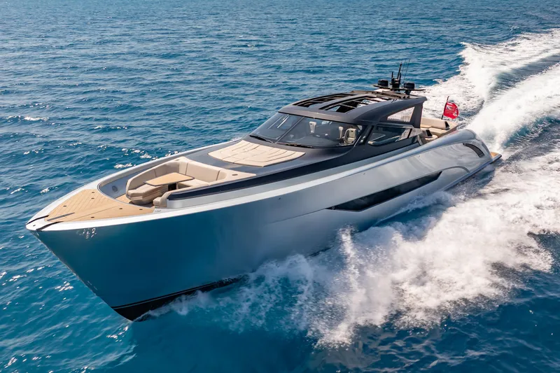 Slide: The Image of Luxury Wajer 77 yacht cruising on open blue sea, showcasing sleek design and elegance. - 1