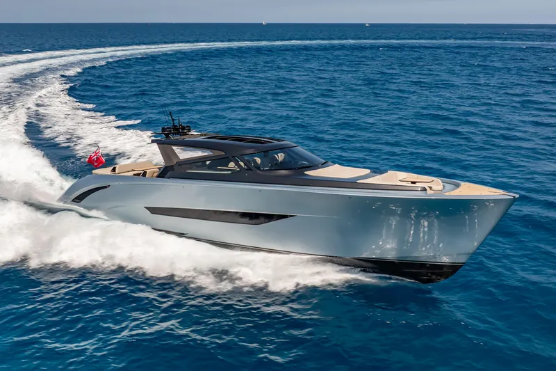 Slide: The Image of Luxurious Wajer 77 yacht cruising swiftly on open blue sea. - 10