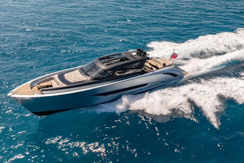 Slide: The Image of Luxury Wajer 77 yacht cruising swiftly on open blue sea. - 11