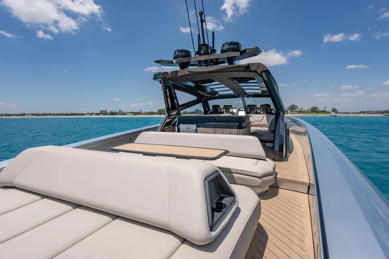 Slide: The Image of Luxury Wajer 77 yacht with spacious deck, cruising on clear blue waters under a sunny sky. - 12