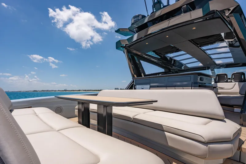 Slide: The Image of Luxurious Wajer 77 yacht deck with elegant seating and ocean view. - 13