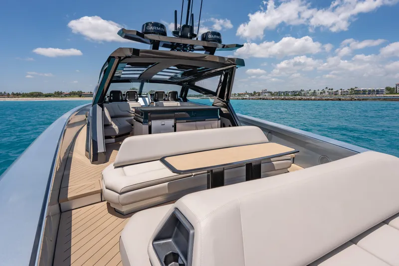 Slide: The Image of Luxury Wajer 77 yacht interior with elegant seating and ocean view. - 16