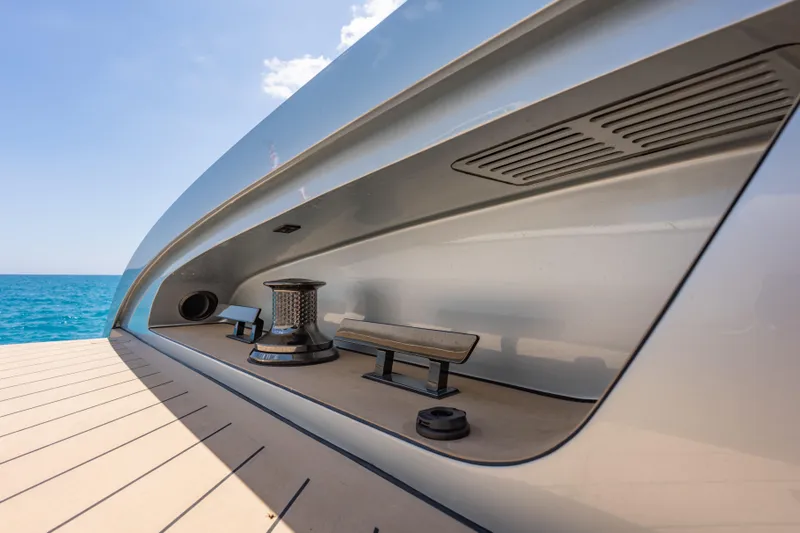 Slide: The Image of Sleek Wajer 77 yacht deck detail with ocean backdrop. - 18
