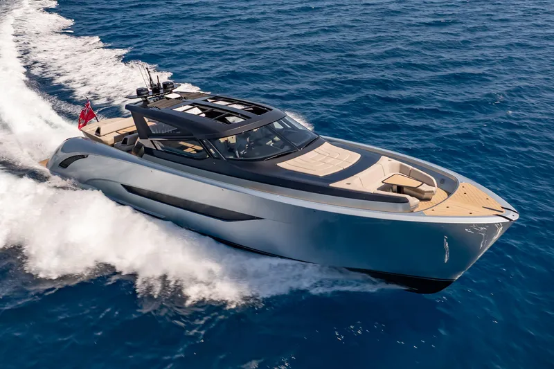 Slide: The Image of Luxury Wajer 77 yacht cruising on open sea, showcasing sleek design and elegance. - 2