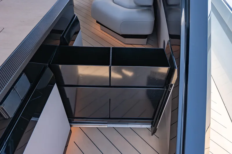 Slide: The Image of Luxurious interior of Wajer 77 yacht featuring sleek black cabinetry and modern design elements. - 26