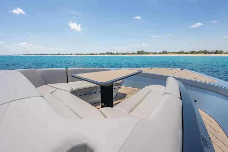 Slide: The Image of Luxurious seating area on Wajer 77 yacht overlooking serene ocean and coastline. - 39