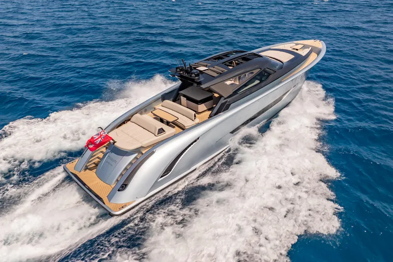Slide: The Image of Luxurious Wajer 77 yacht cruising on open sea, showcasing sleek design and elegance. - 4