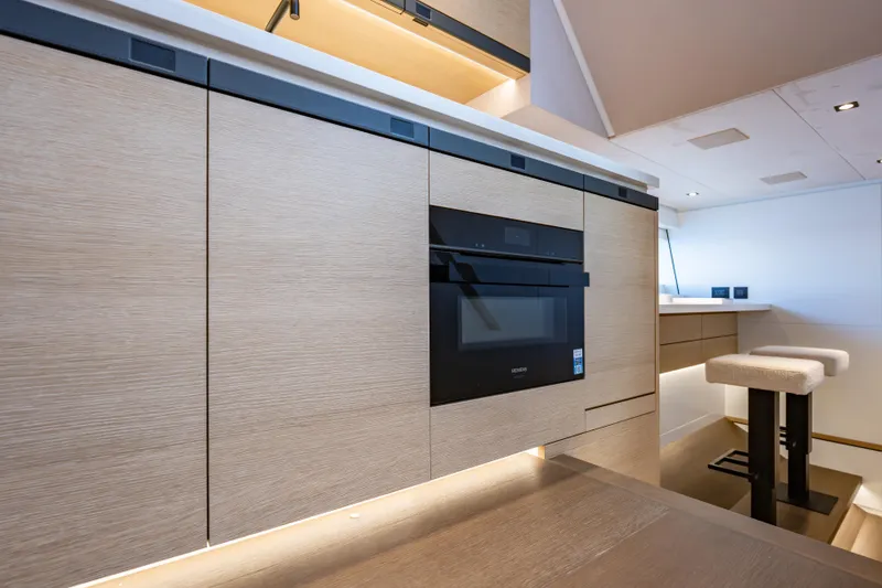 Slide: The Image of Modern kitchen interior on Wajer 77 yacht, featuring sleek cabinetry and built-in appliances. - 46