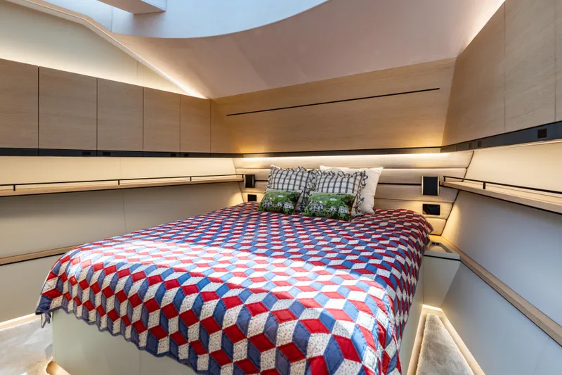 Slide: The Image of Luxurious Wajer 77 yacht bedroom with modern design and geometric bedspread. - 47