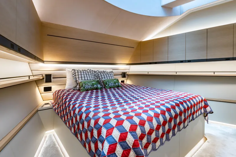 Slide: The Image of Luxurious cabin interior of Wajer 77 yacht with geometric-patterned bedding and modern lighting. - 48