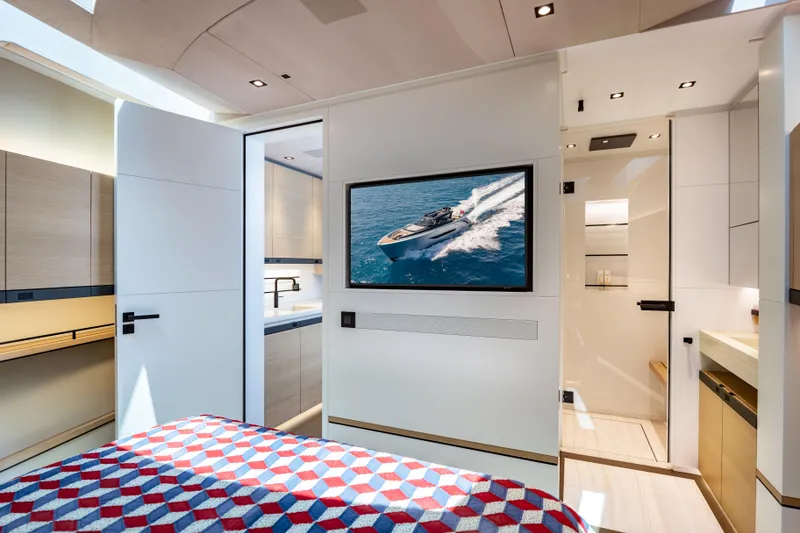 Slide: The Image of Luxurious interior of Wajer 77 yacht featuring modern design and a vibrant bedspread. - 49