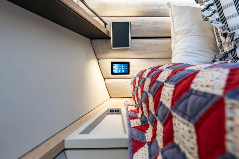 Slide: The Image of Luxurious Wajer 77 yacht interior with modern bedding and integrated technology. - 51