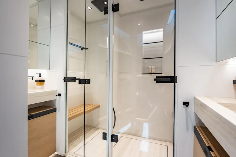 Slide: The Image of Luxurious Wajer 77 yacht bathroom with glass shower, modern fixtures, and elegant wood accents. - 53
