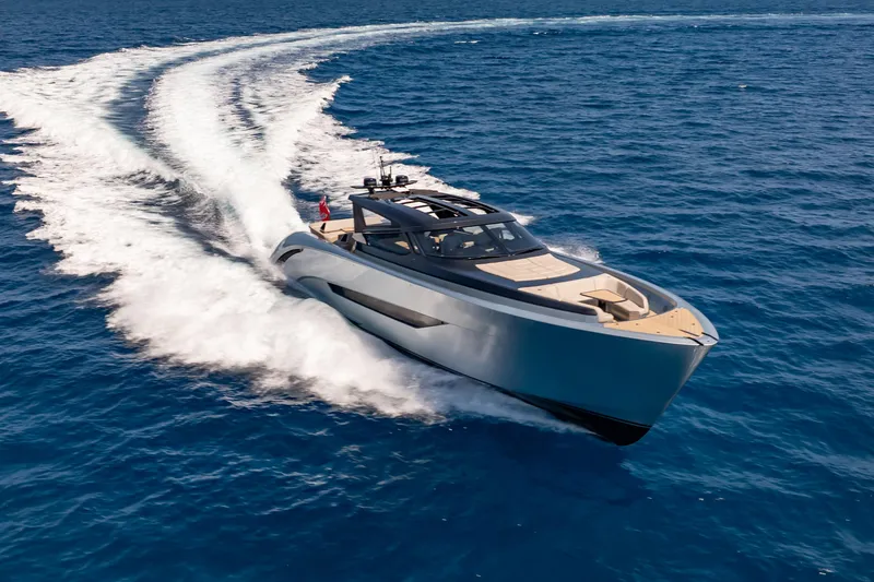 Slide: The Image of Luxury Wajer 77 yacht cruising swiftly on open blue sea. - 8