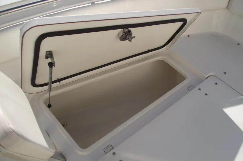 Slide: The Image of Open storage compartment on a 2014 Sea Hunt Gamefish 25 boat. - 10