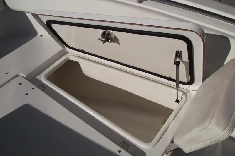 Slide: The Image of Open storage compartment on a 2014 Sea Hunt Gamefish 25 boat. - 12