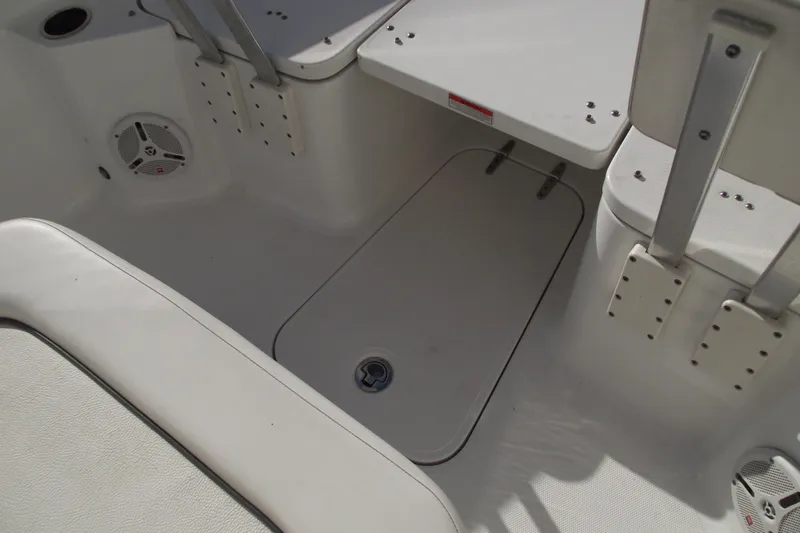 Slide: The Image of 2014 Sea Hunt Gamefish 25 boat interior with seating and storage compartments. - 13