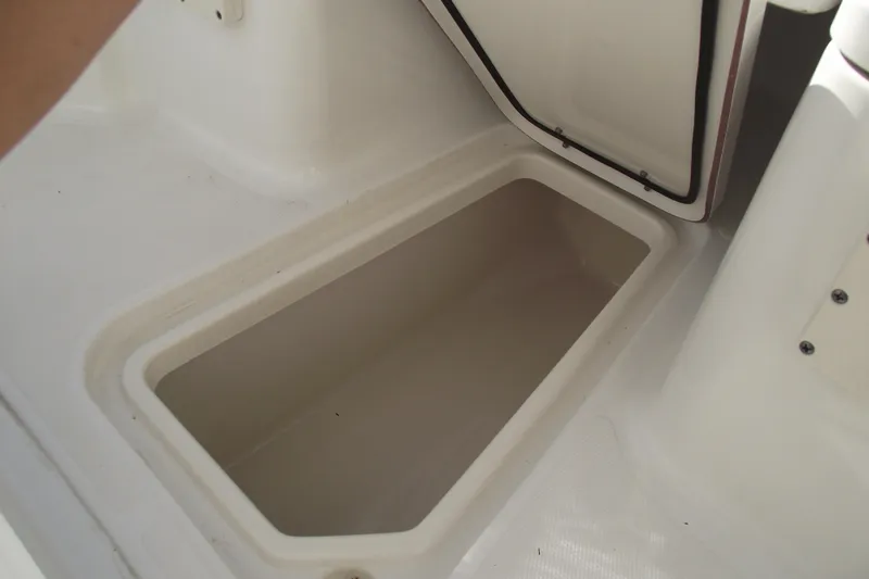 Slide: The Image of Open storage compartment on a 2014 Sea Hunt Gamefish 25 boat. - 14