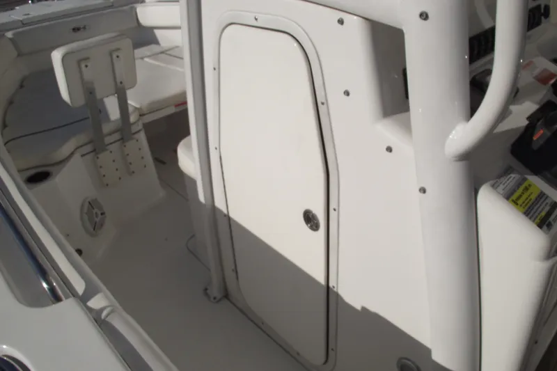 Slide: The Image of 2014 Sea Hunt Gamefish 25 boat interior with seating and storage compartment. - 17