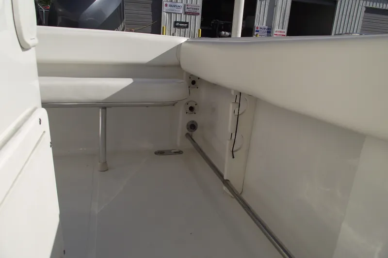 Slide: The Image of 2014 Sea Hunt Gamefish 25 interior, showcasing seating and storage area. - 27
