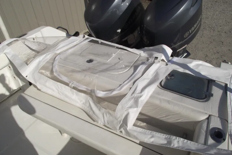 Slide: The Image of 2014 Sea Hunt Gamefish 25 boat with Yamaha engines and covered storage area. - 29