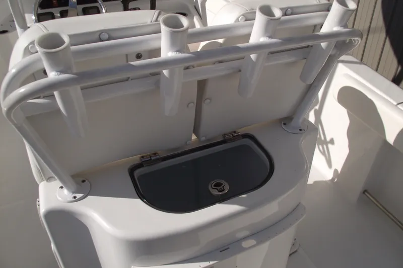 Slide: The Image of 2014 Sea Hunt Gamefish 25 boat with rod holders and storage compartment. - 30